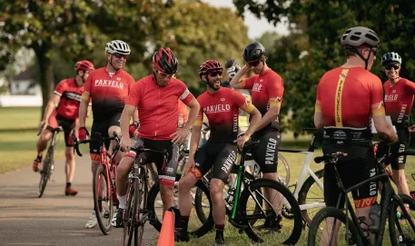 PaxVelo riders in club kit gathering for a group ride